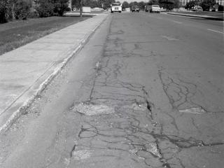 photo of road needing repairs