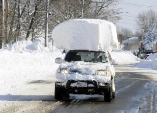 photo of vehicle with 2 feet of snow on roof