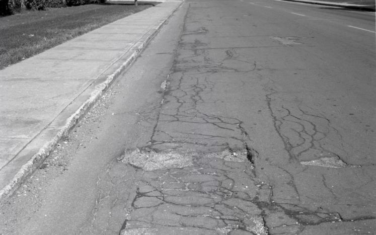 photo of road needing repairs